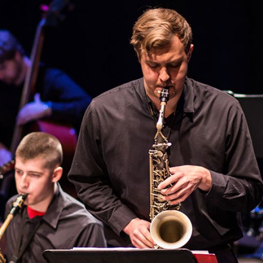 Photo of student playing saxophone in concert