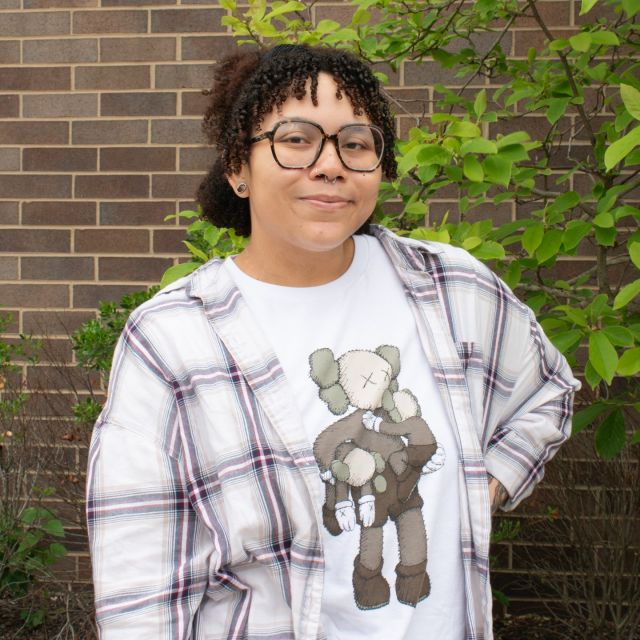 It’s the final Feature Friday of the semester and we are featuring Nariko Johnson! Nariko is a graphic design major and she will be graduating from Rutgers–Camden this Spring! For as long as Nariko can remember she has always loved art. She was a fine arts major before becoming a graphic design major, and she even wanted to be an art teacher when she was a kid. Prof. Allan Espiritu has been really influential in Nariko’s journey through graphic design and he has been a great role model for her work. When making designs, she strives to impact other people through the work that she does. Nariko’s goal for the future is to be a successful graphic designer in Japan. Some of Nariko’s greatest accomplishments have been being able to work with autistic and disabled individuals. She is immensely proud of the work that she has produced that is being shown in the Stedman Gallery. Nariko has worked hard for the thesis show Ask Me Anything and is looking forward to celebrating it at its reception tonight!
📸 : Abby Vanono